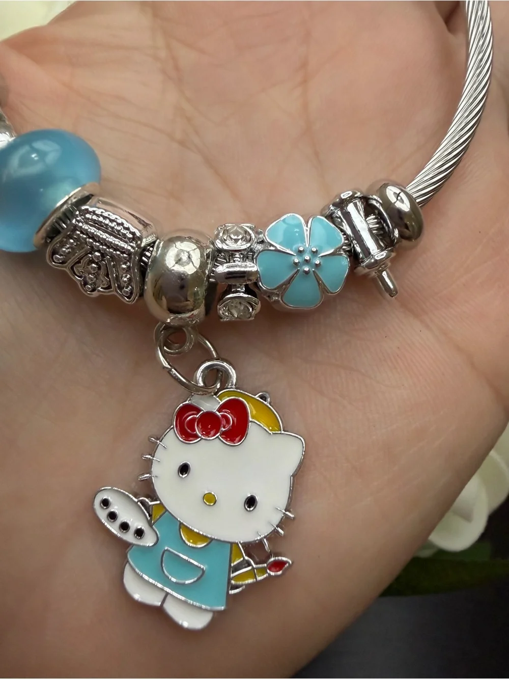 Silver Cable Charm Bangle with Blue Flower Beads and Hello Kitty Charm